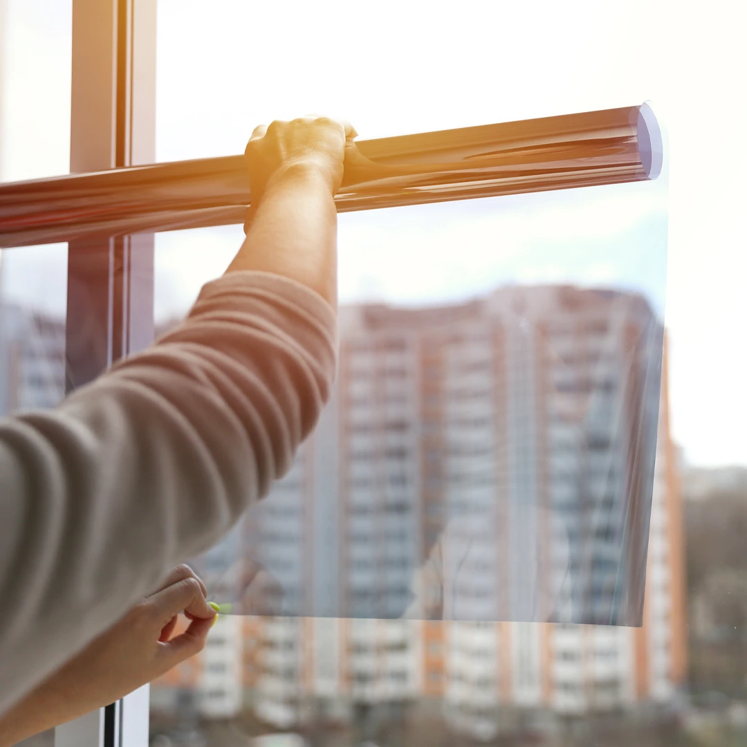 Heated Window Film Being Applied To An Office Window.