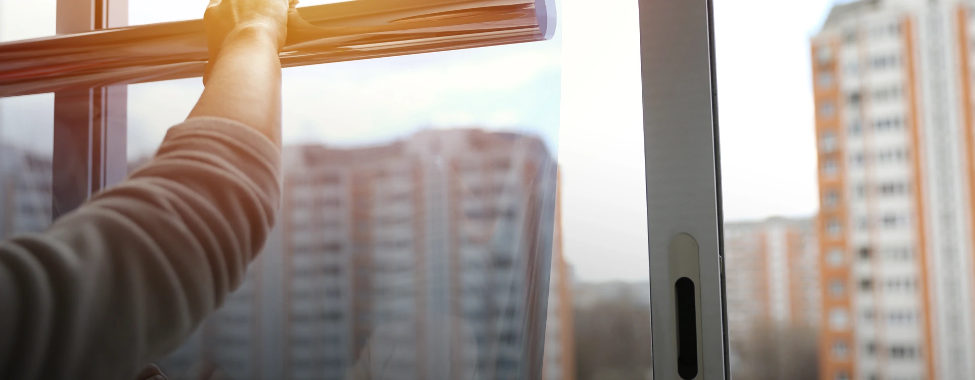 Heat Reflective Film Being Applied To An Office Window.